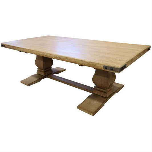 Aster solid mango wood pedestal coffee table with honey wash finish, featuring a smooth, rounded top and sturdy pedestal base in natural wood tones.
