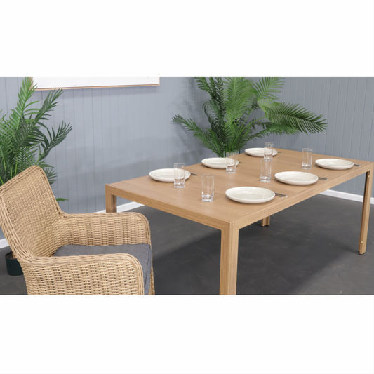 CAPELL 1800 7-PIECE OUTDOOR DINING SUITE TEAK LOOK WICKER ON ALUMINIUM FRAME/CHARCOAL CUSHIONS - MyChocolateWood
