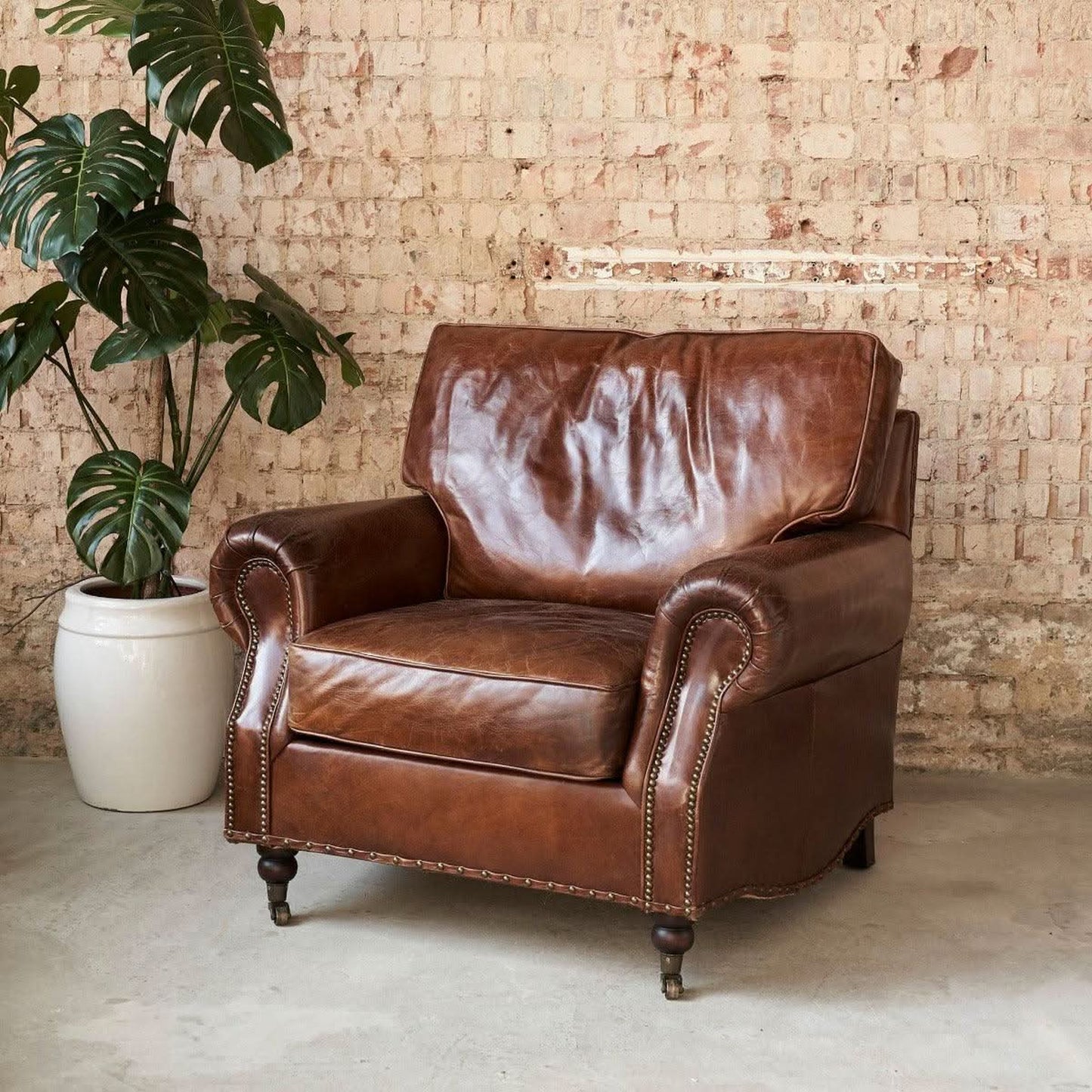 CHARLESTON AGED LEATHER ARMCHAIR IN ORIGINAL AGED LEATHER