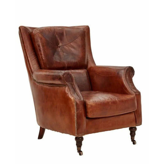 Aged leather Cleopatra arm chair by MyChocolateWood with plush cushioning and elegant design, shown in a cozy living room setting.
