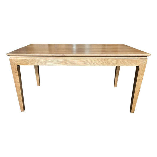 Ella solid oak dining table by MyChocolateWood in natural finish, shown in 150cm size with smooth wooden surface and sturdy legs.