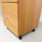 TELMA TASSIE OAK SMALL FILING CABINET IN CLEAR LACQUER ON WHEELS - MyChocolateWood