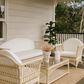 Natural rattan armchair with white cushion from Denize Hamptons collection by MyChocolateWood, featuring a stylish easy chair design.