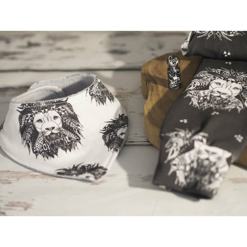 Monochrome baby bib in Aztec lion paired with monochrome baby leggings in Lion Noir