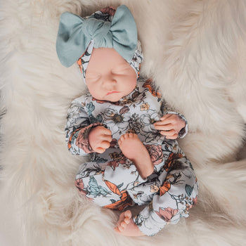 floral sleepsuit with matching bow turban. Handmade in the UK for babies and Toddlers 0 - 5 years
