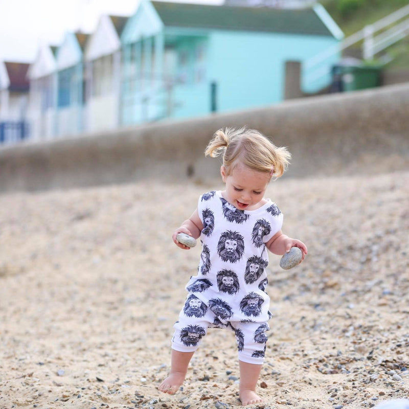 Baby Romper - Toddler wearing Lottie & Lysh Aztec Lion zipless romper on a beach