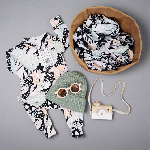 90s style dash art babygrow by lottie and lysh