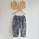 kids leopard print cord trousers in blue, black and white.