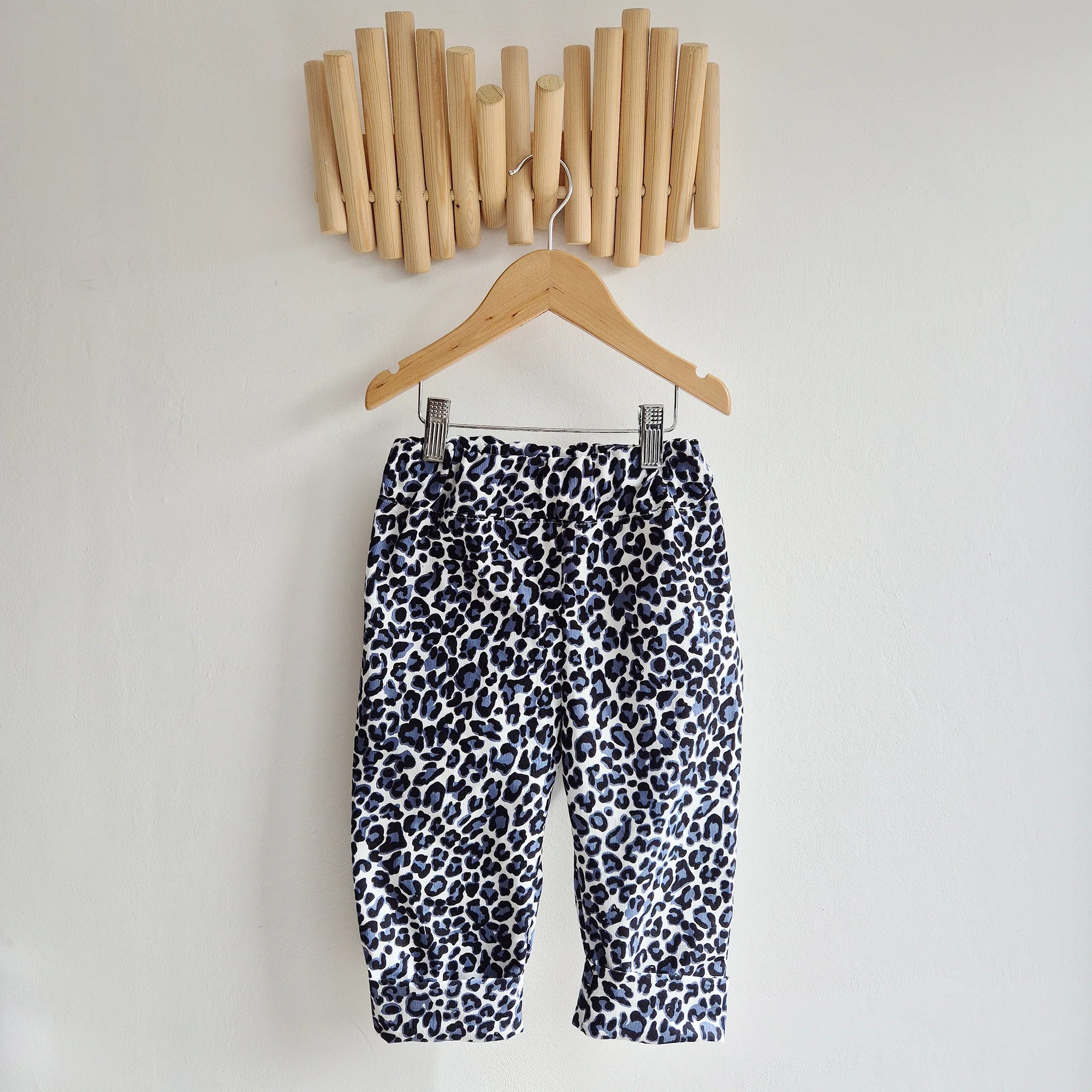 kids leopard print cord trousers in blue, black and white.