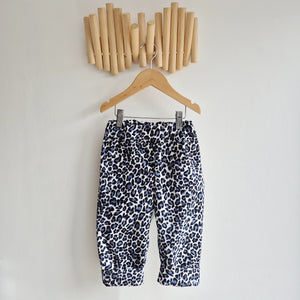 kids leopard print cord trousers in blue, black and white.