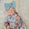newborn floral baby grow with matching bow 