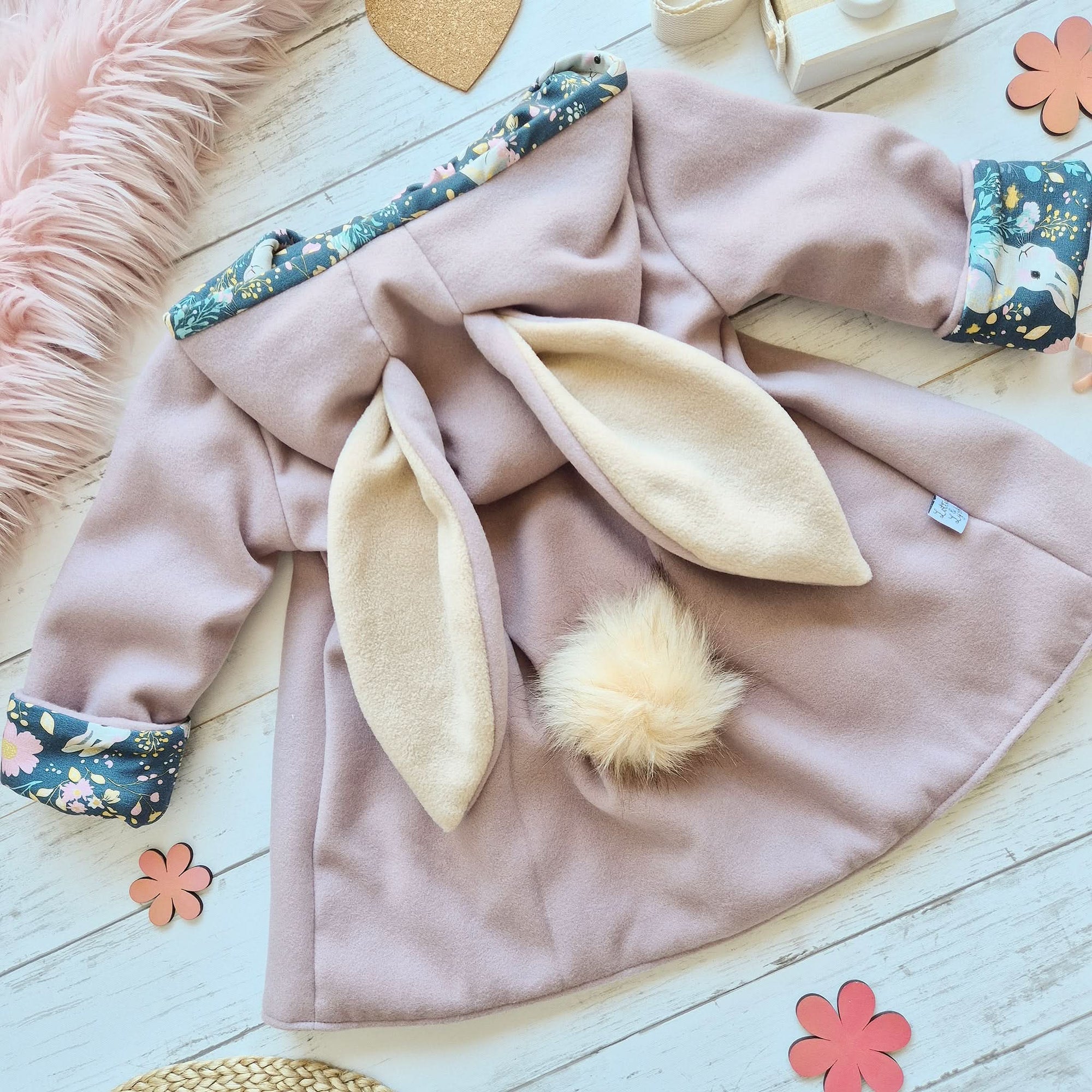 Mauve vegan wool girls bunny jacket with blue and floral bunny print lining and removeable pom tail