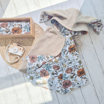 floral-lined reversible bodywarmer. Lightweight and ethical vest for kids, perfect for layering.