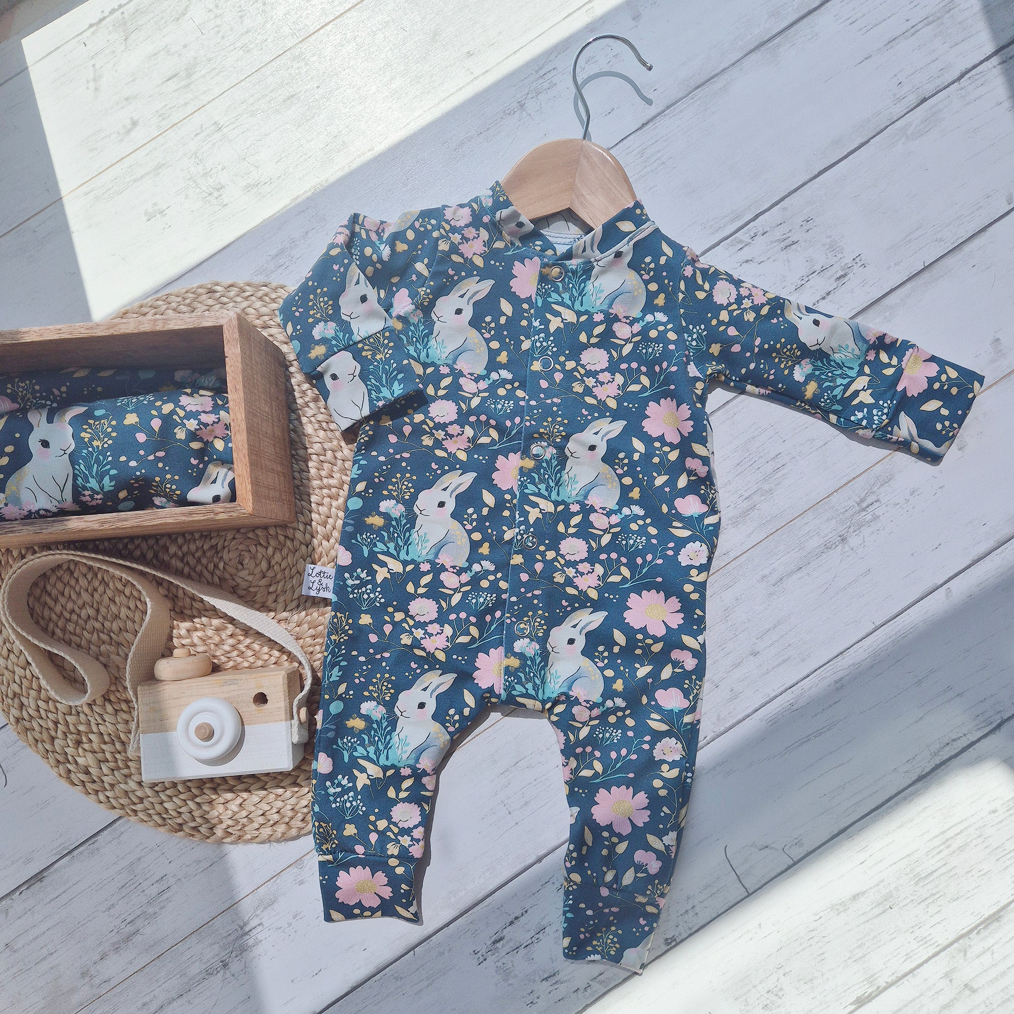 Baby girl outfit with florals and bunny rabbit print.