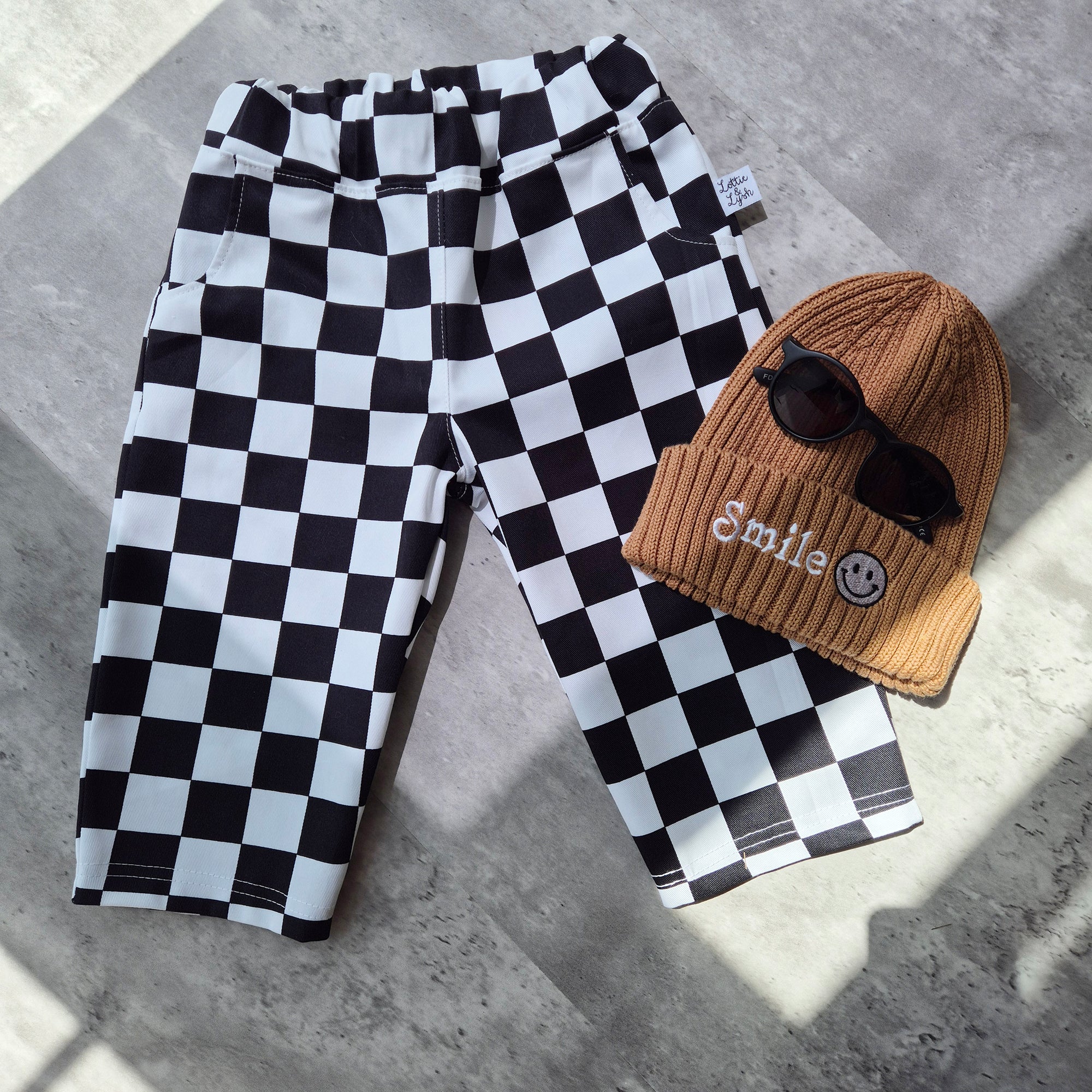 Baggy toddler trousers in black and white chefs checks fabric