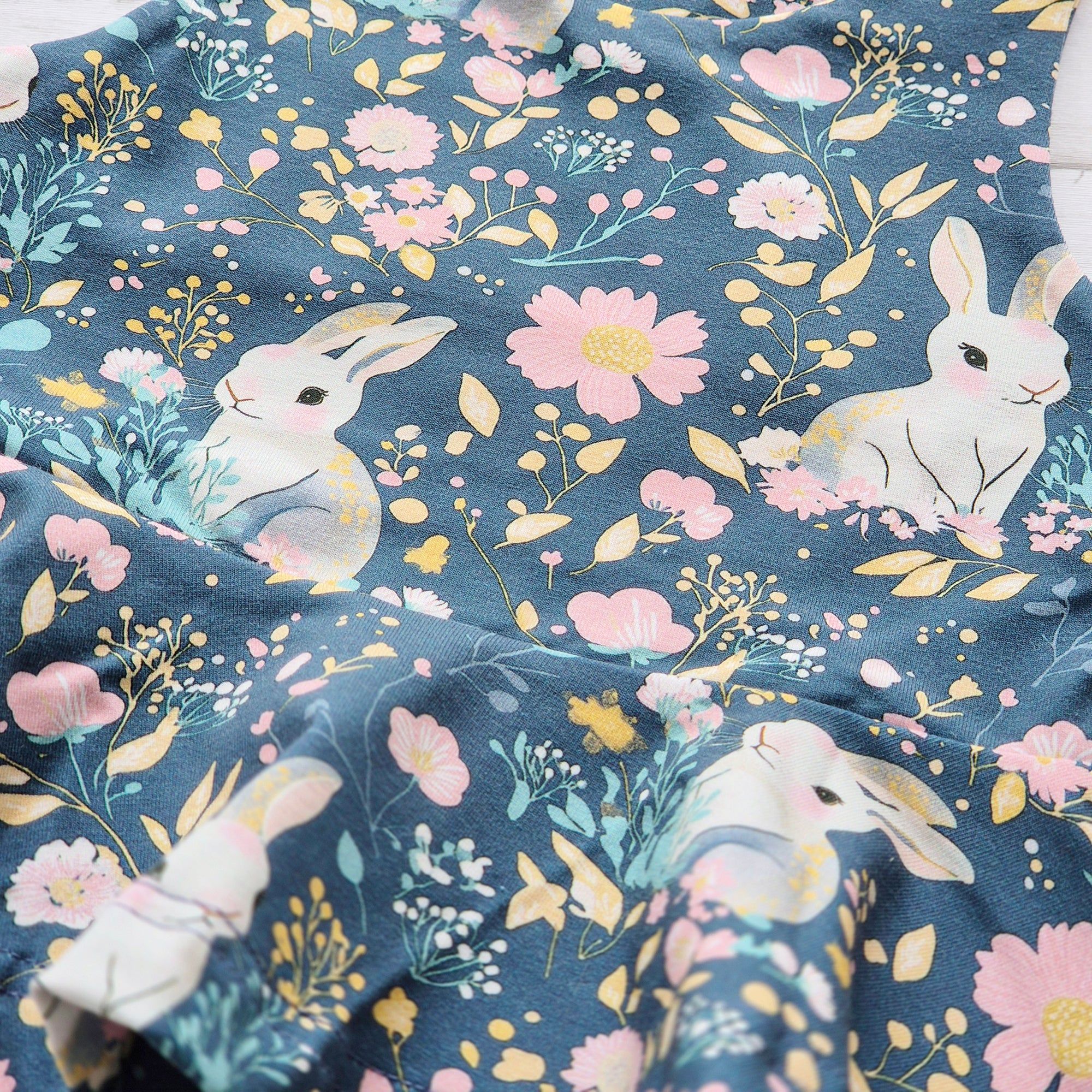Close-up of sleeveless girls peplum top in ethical cotton jersey