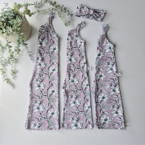 retro inspired wide-leg playsuit handmade by Lottie & Lysh. Featuring a mauve background with black and white lily print design. 