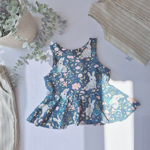 Bunny and floral print girls peplum vest 0-10 years. Handmade in the UK by ethical brand Lottie Lysh. 