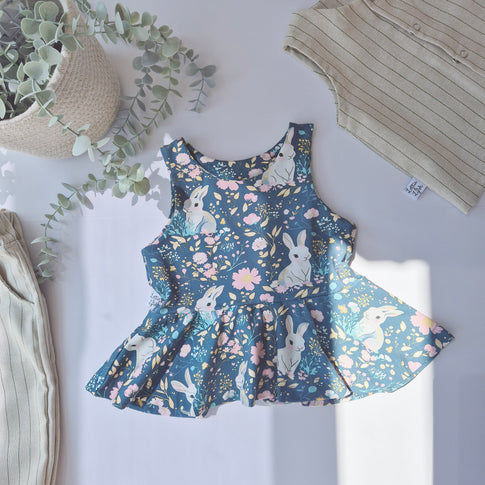 Bunny and floral print girls peplum vest 0-10 years. Handmade in the UK by ethical brand Lottie Lysh. 