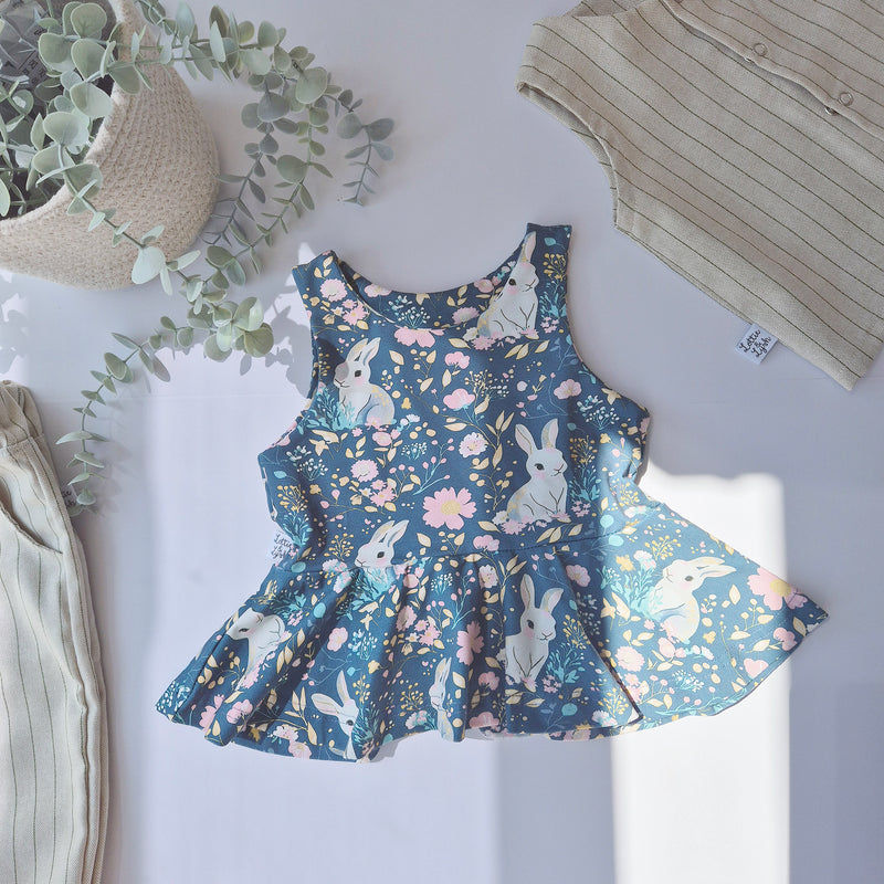 Bunny and floral print girls peplum vest 0-10 years. Handmade in the UK by ethical brand Lottie Lysh. 