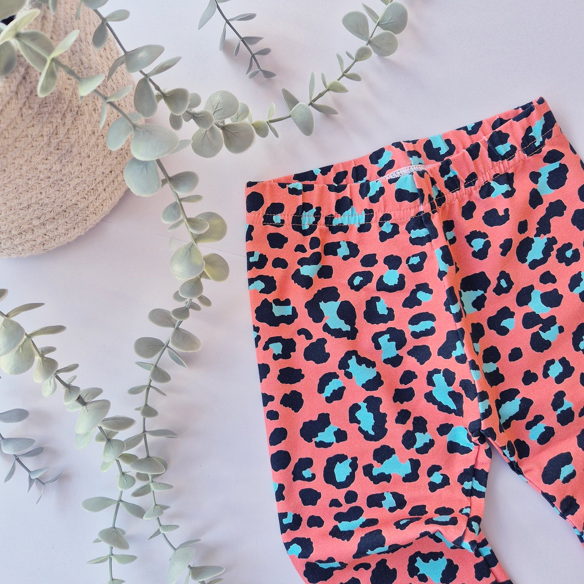 orange and blue leopard print leggings for babies and kids. Handmade in the UK by Lottie & Lysh
