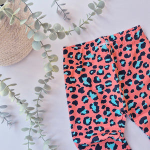 orange and blue leopard print leggings for babies and kids. Handmade in the UK by Lottie & Lysh