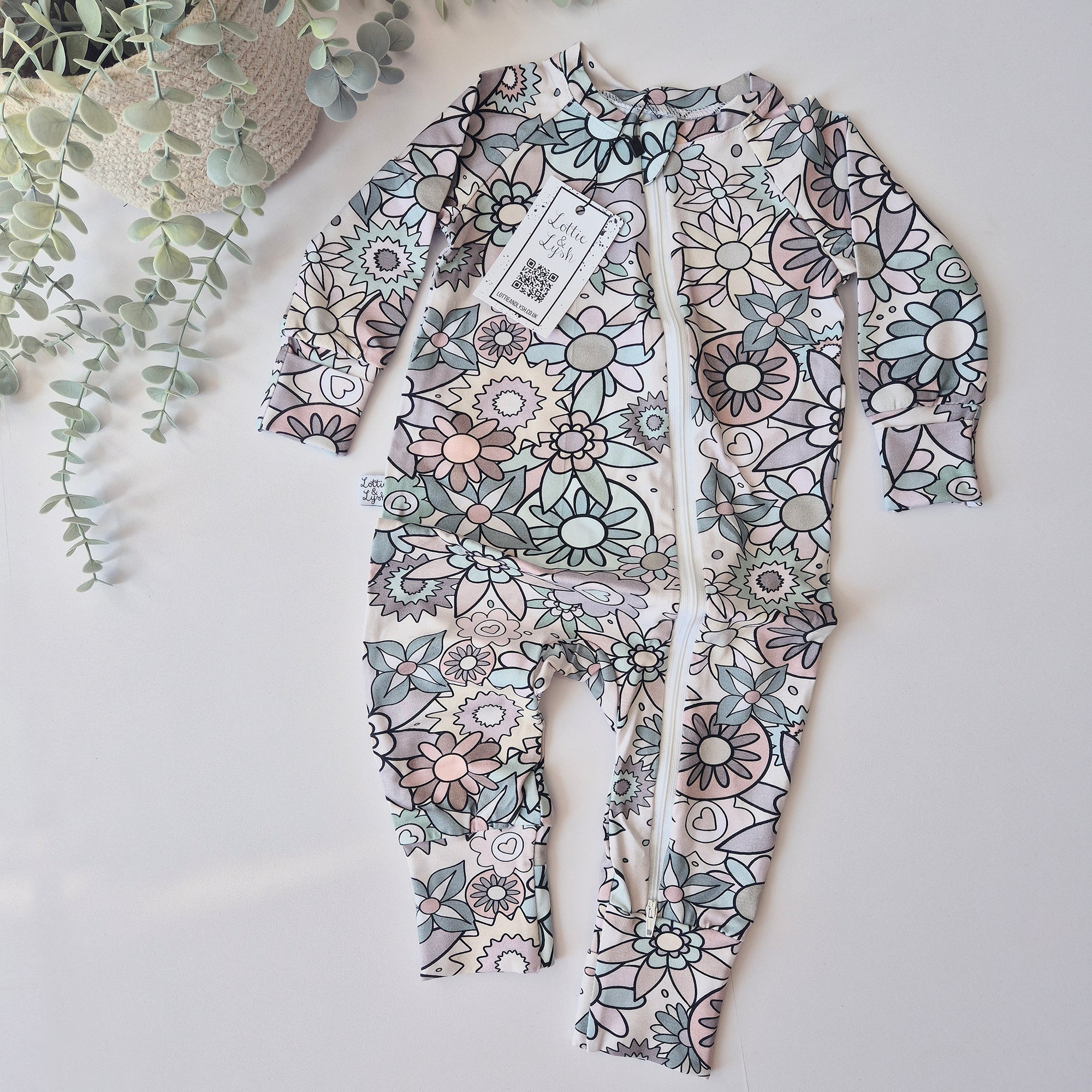 baby girl zip sleepsuit with floral pattern