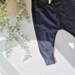 Navy harem leggings against a white background