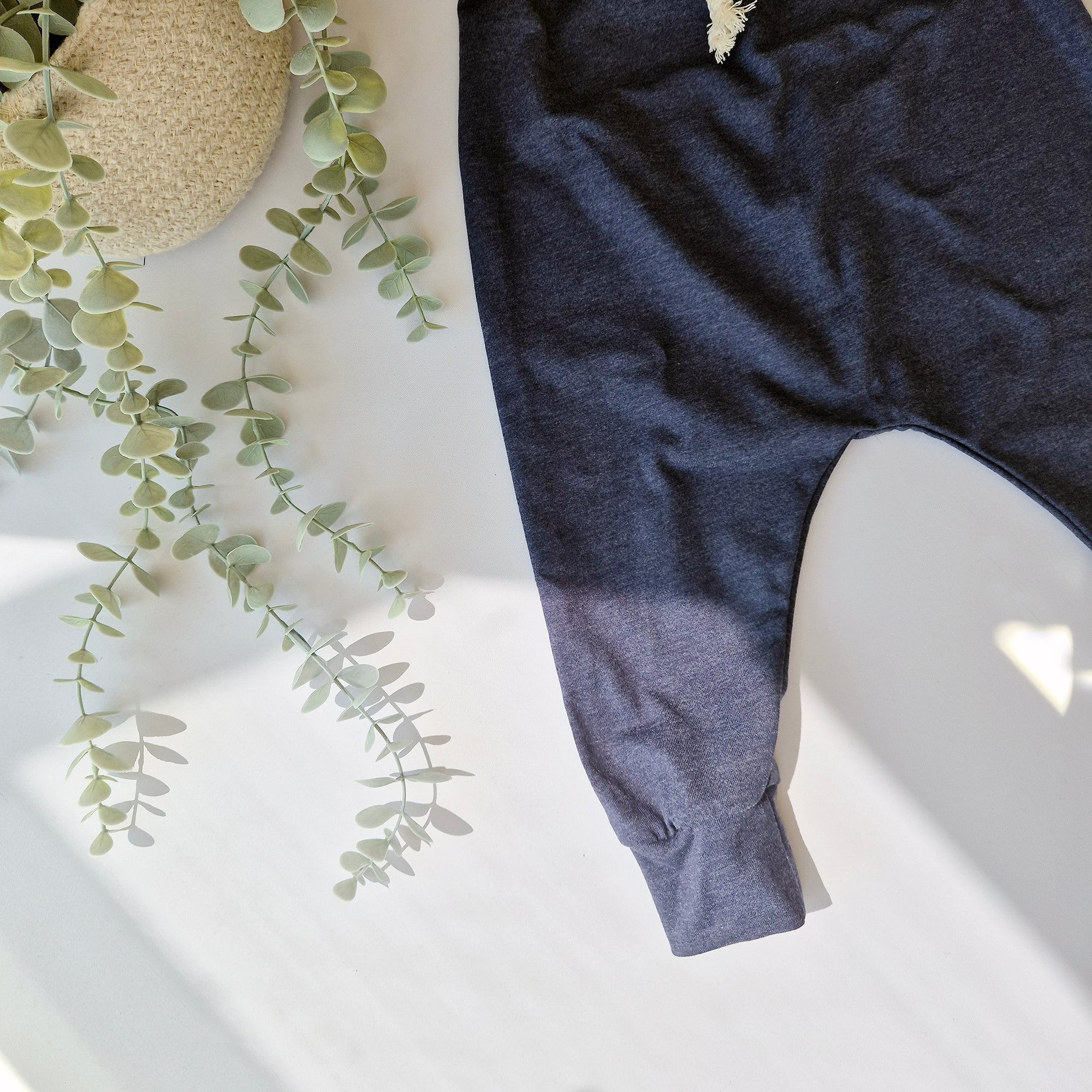 Navy harem leggings against a white background