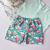 Children's shorts with cherubs and heart pattern on a light green shirt