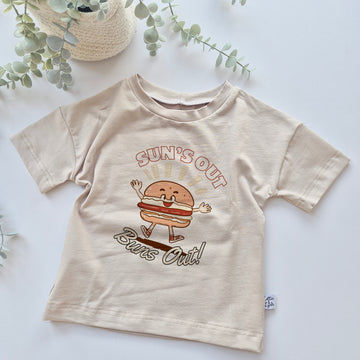 Kids Beige t-shirt with a cartoon hamburger design and text on a light background
