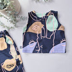 Children's sleeveless top with abstract pattern on a navy background
