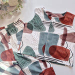Children's clothing with abstract pattern on a light background