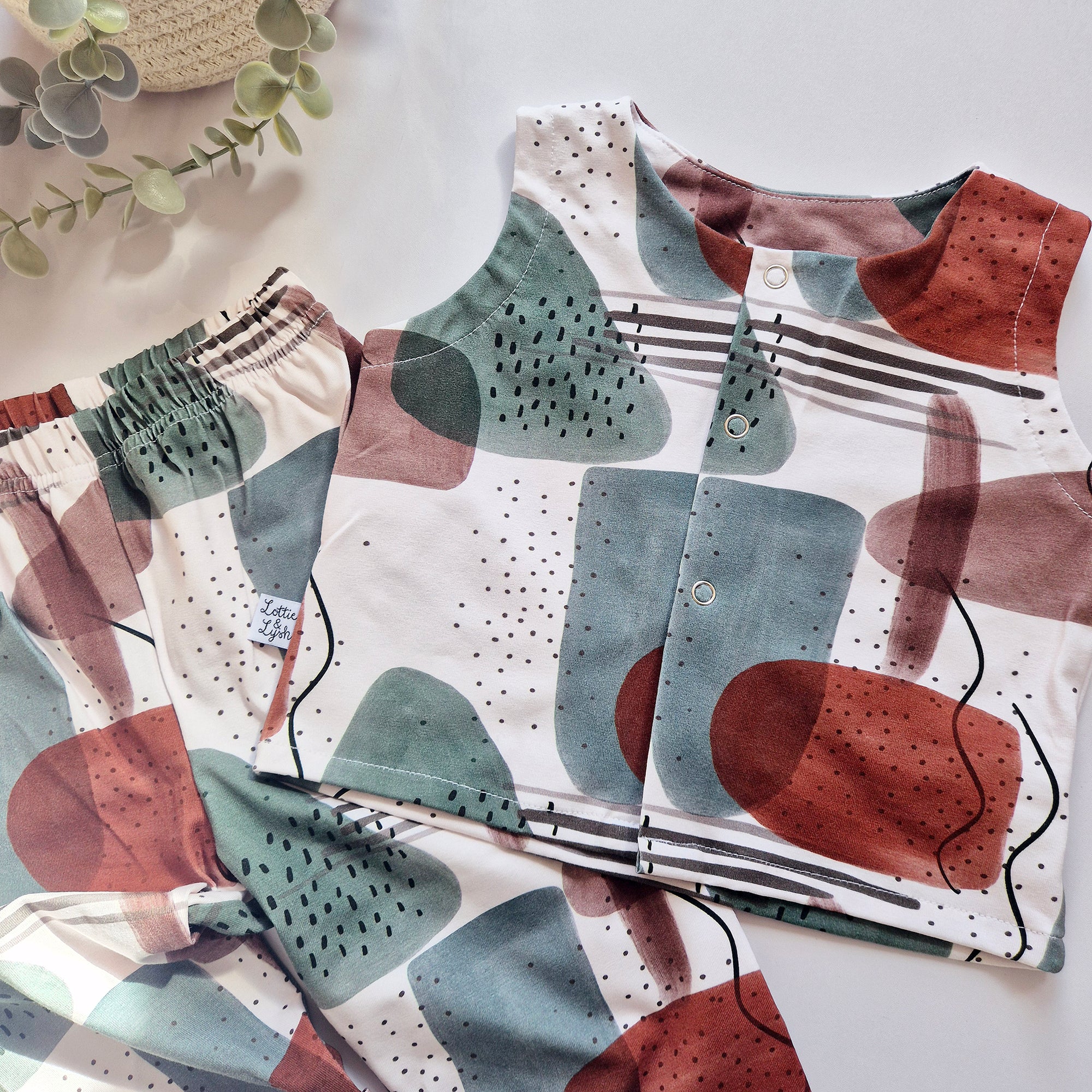 Children's clothing with abstract pattern on a light background