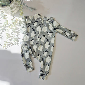 Penguin Print baby sleepsuit. Handmade in the UK by Lottie & Lysh