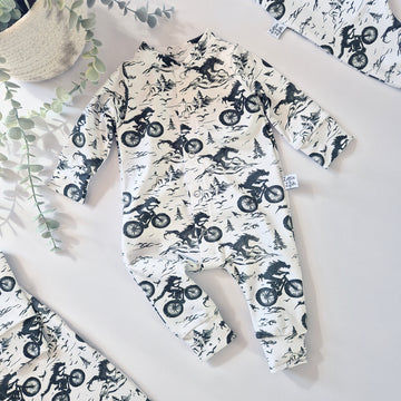 Alternative style baby romper featuring dragons on motorbikes. Sustainably made in the UK by Lottie & Lysh, Cornwall.