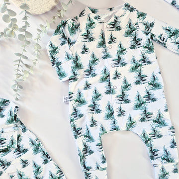 Unisex Baby Romper with green trees on a white background
