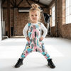 little girl wearing fresh dungarees on location photoshoot
