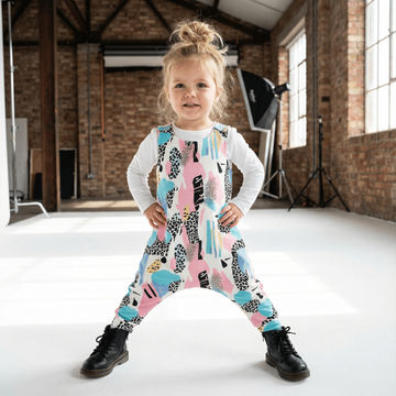 little girl wearing fresh dungarees on location photoshoot