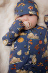 new baby wearing winnie the pooh babygrow and matching baby hat