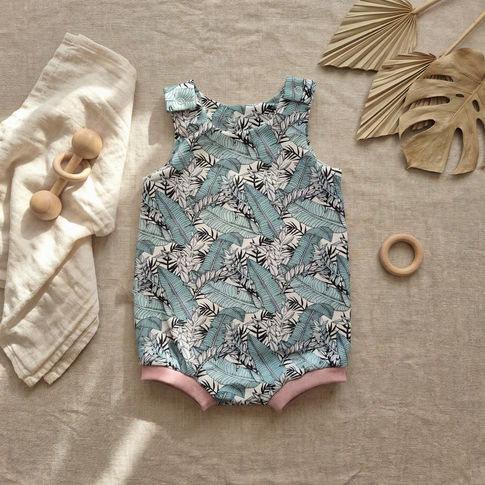 Tropicana summer baby romper flat lay
