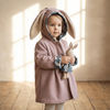 Little girl wearing the mauve and bunny love bonnie bunny jacket by Lottie & Lysh