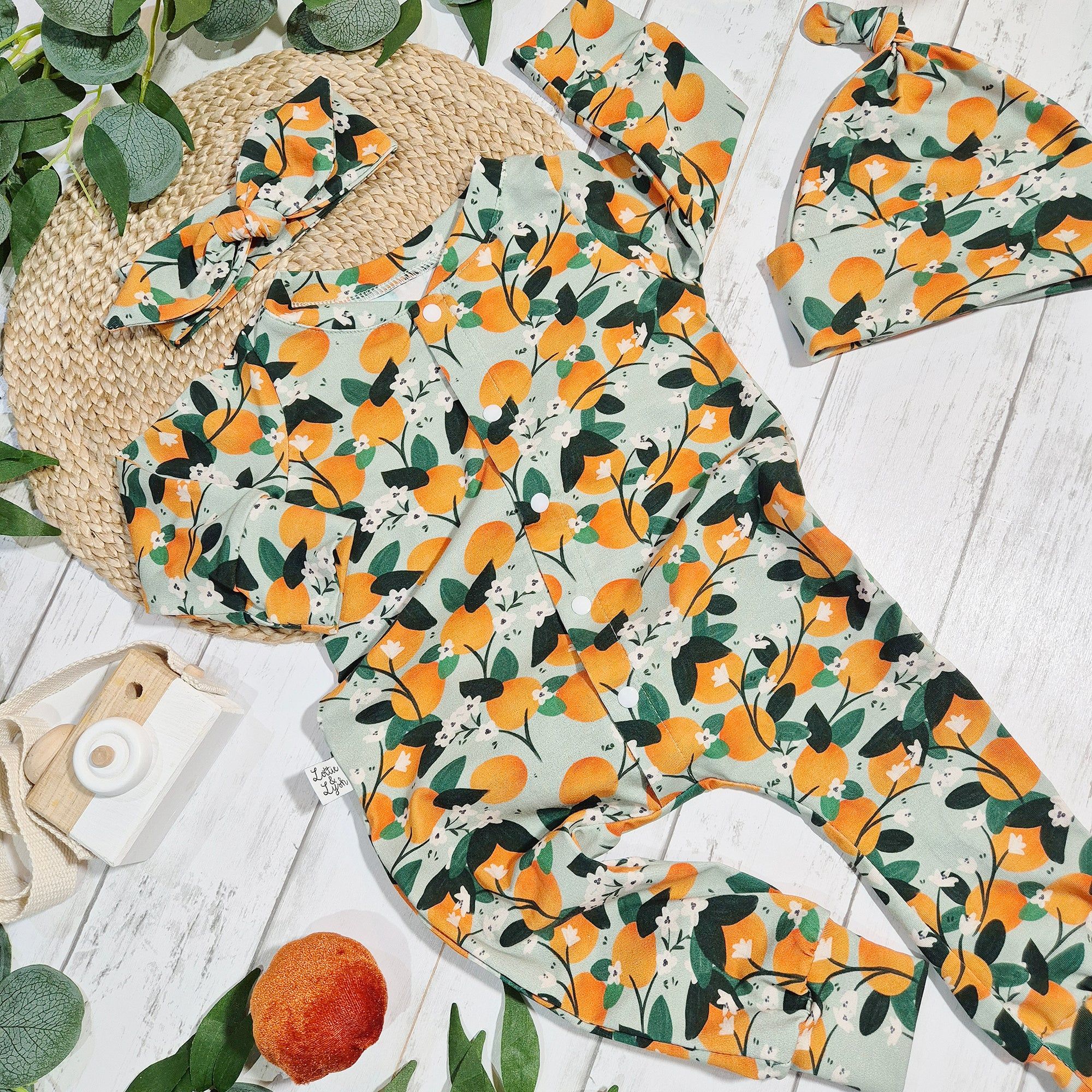 orange print baby and toddler romper by Lottie & Lysh