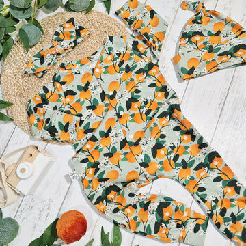 orange print baby and toddler romper by Lottie & Lysh