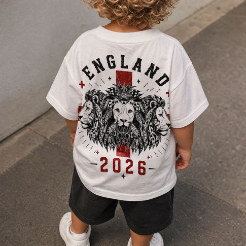 Child wearing a white t-shirt with 'ENGLAND 2026' design on the back.