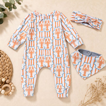 Baby clothing set laid flat on a beige surface, including a long-sleeve footless romper, a matching headband, and a bib. The fabric has an orange lobster print on a white background with light blue vertical stripes.