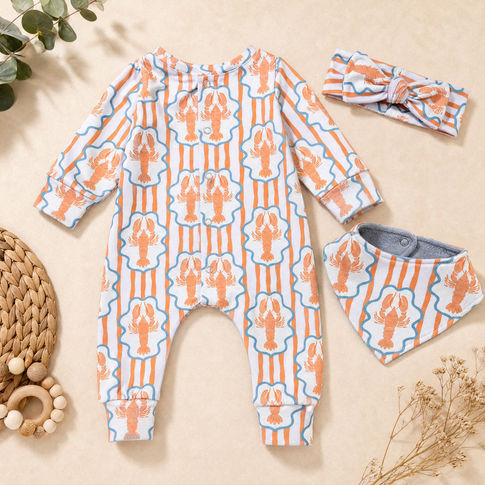 Baby clothing set laid flat on a beige surface, including a long-sleeve footless romper, a matching headband, and a bib. The fabric has an orange lobster print on a white background with light blue vertical stripes.