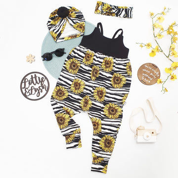 Black and white stripey romper for children. Handmade in the UK by Lottie & Lysh