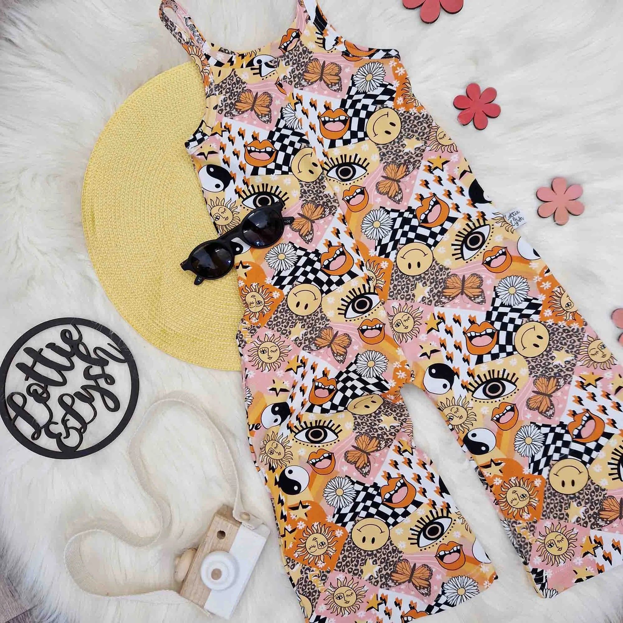 kids 70s style outift by Lottie & lysh. 70s inspired printed jumpsuit with accessories