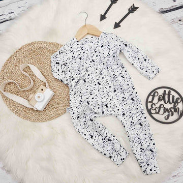 black and white baby romper with paint splatter effect by Lottie & Lysh